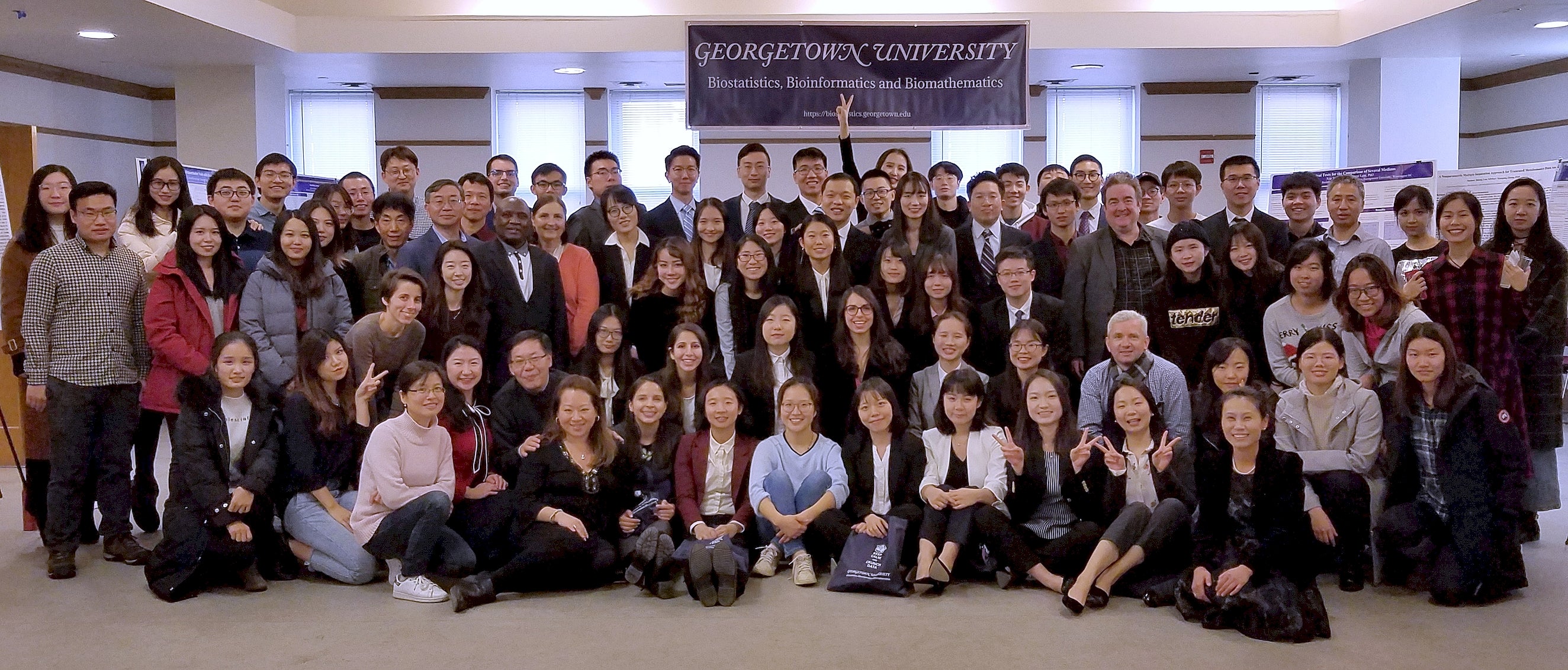 Graduating MS students, first-year MS students and Ph.D. students pose with faculty and staff at the 11th Annual Research Practicum Defense.