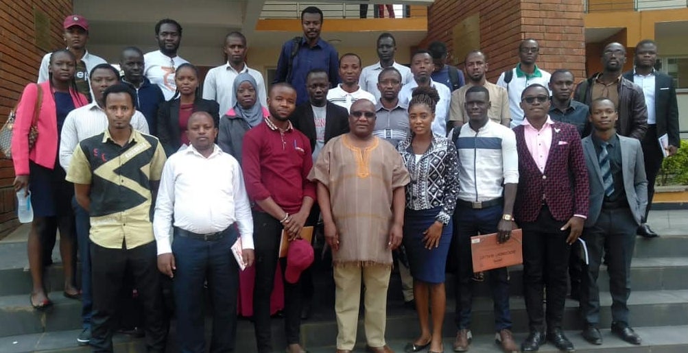 Dr. Kepher Makambi with students from PAUISTI at Jomo Kenyatta University.