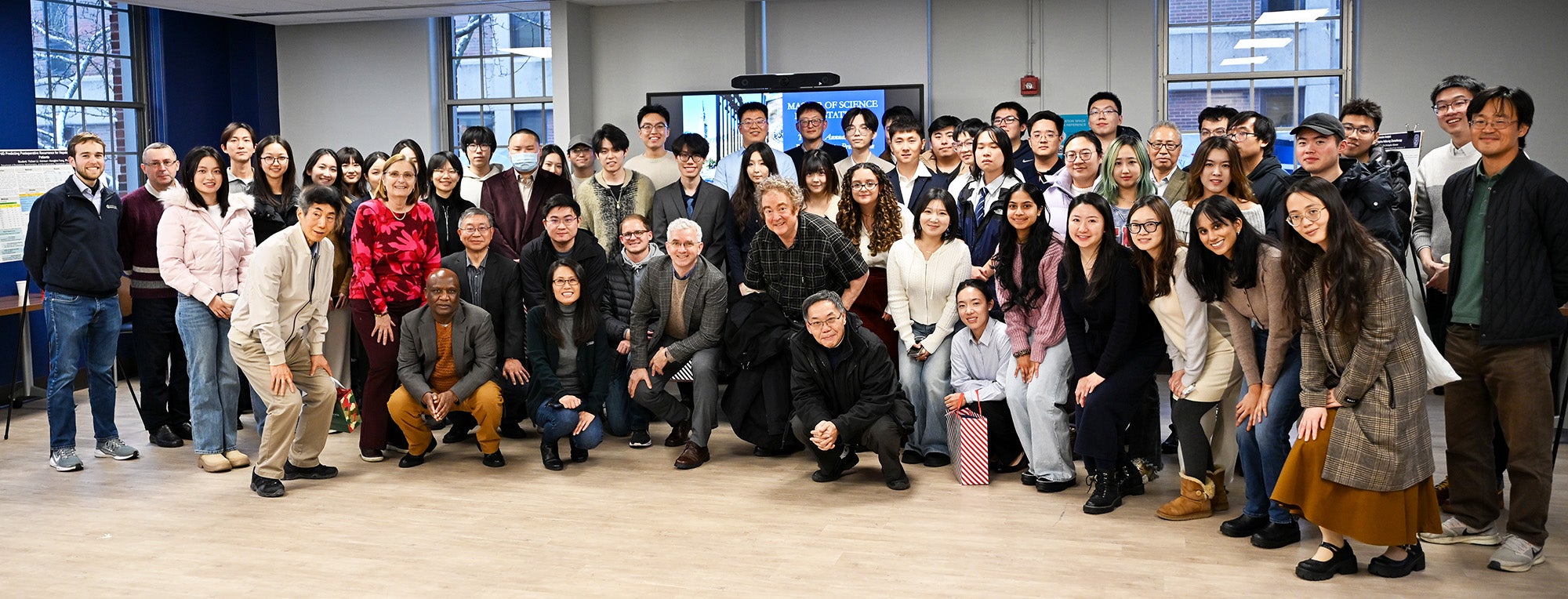 Master's and Ph.D. students, faculty and staff at the December 2025 M.S. in Biostatistics Practicum Poster Presentation